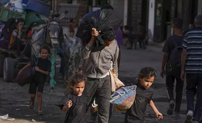 Displaced Palestinians flee Jabalia after the Israeli army issued evacuation orders in Gaza City, June 29, 2025. (AP Photo/Jehad Alshrafi)
