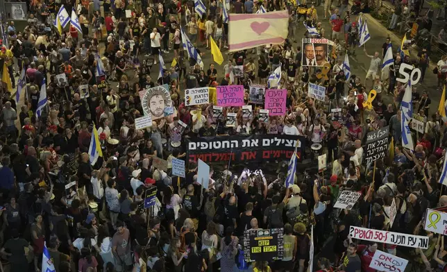 People take part in a protest demanding the end of the war and immediate release of hostages held by Hamas in the Gaza Strip, and against Prime Minister Benjamin Netanyahu's government in Tel Aviv, Israel, Saturday, June 28, 2025. (AP Photo/Ariel Schalit)