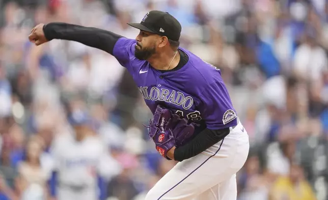 Colorado Rockies starting pitcher Germán Márquez works against the Los Angeles Dodgers in the first inning of a baseball game Tuesday, June 24, 2025, in Denver. (AP Photo/David Zalubowski)