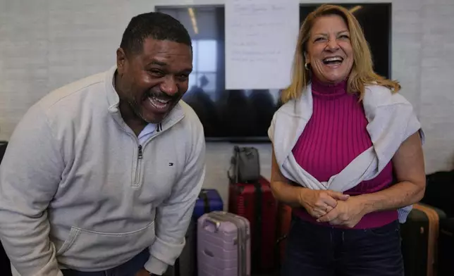 Rocky Mount Police Department Capt. James Staten, left, and Luann Pannell, director of instructional design and academic innovation with the Policing Leadership Academy, participate in an improvisational exercise lead by The Second City instructors during a Univeristy of Chicago Crime Lab class that is part of the Leadership program, on April 11, 2025, in Chicago. (AP Photo/Erin Hooley)