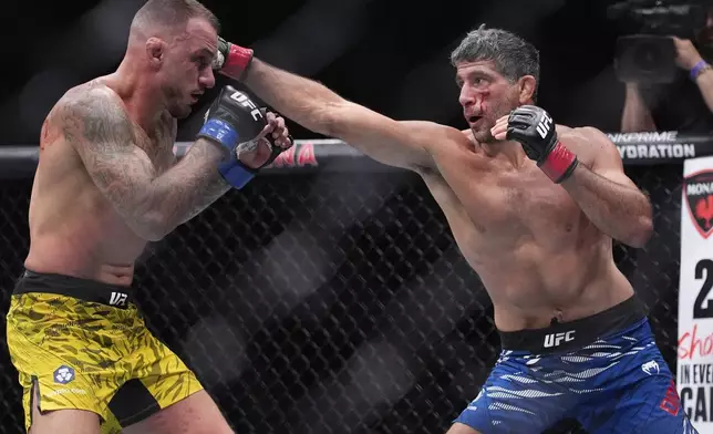 Beneil Dariush hits Renato Moicano in a lightweight fight at UFC 317, Saturday, June 28, 2025, in Las Vegas. (AP Photo/John Locher)