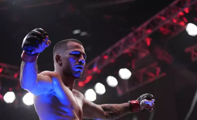 Alexandre Pantoja celebrates after defeating Kai Kara-France in a flyweight title fight at UFC 317, Saturday, June 28, 2025, in Las Vegas. (AP Photo/John Locher)