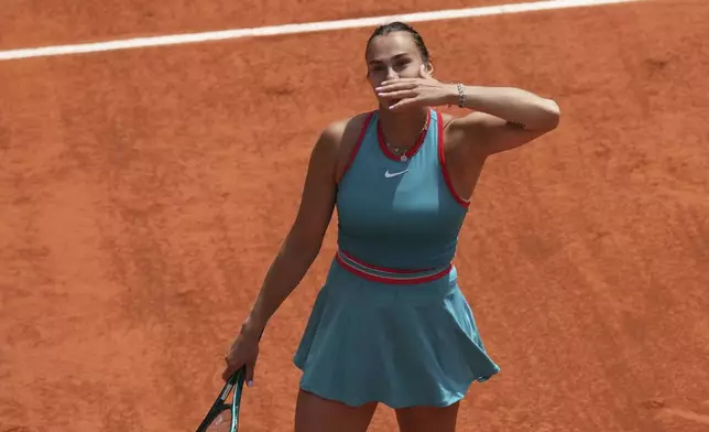 Aryna Sabalenka of Belarus celebrates as she won the quarterfinal match of the French Tennis Open against China's Qinwen Zheng at the Roland-Garros stadium in Paris, Tuesday, June 3, 2025. (AP Photo/Christophe Ena)