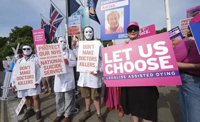 Campaigners supporting and opposing the assisted dying Bill demonstrate at Parliament Square, Westminster, central London, ahead of a debate on the Terminally Ill Adults (End of Life) Bill in the House of Commons, Friday, June 20, 2025. ( Lucy North//PA via AP)