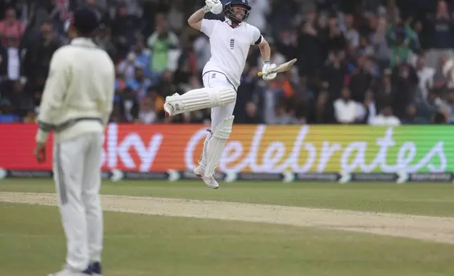 England's Ben Duckett celebrates after scoring a century on day five of the first cricket test match between England and India at Headingley in Leeds, England, Tuesday, June 24, 2025. (AP Photo/Scott Heppell)
