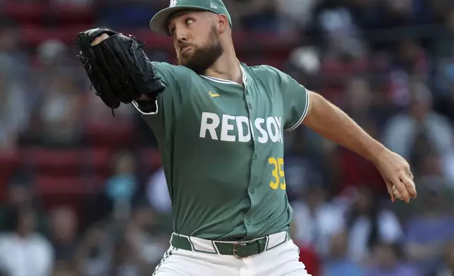 Boston Red Sox pitcher Garrett Crochet winds up during a baseball game against the New York Yankees, Friday, June 13, 2025, in Boston. (AP Photo/Jim Davis)