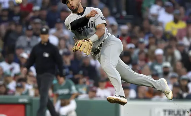 New York Yankees third baseman Oswald Peraza throws to first base, but the throw is too late to get the Boston Red Sox's Romy Gonzalez (not pictured) in the third inning of a baseball game Friday, June 13, 2025, in Boston. (AP/Photo/Jim Davis)