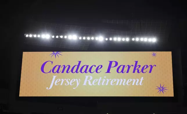 A general view of an LED screen is seen with Candace Parker jersey retirement signage prior to a WNBA basketball game between the Los Angeles Sparks and the Chicago Sky, Sunday, June 29, 2025, in Los Angeles. (AP Photo/Jessie Alcheh)