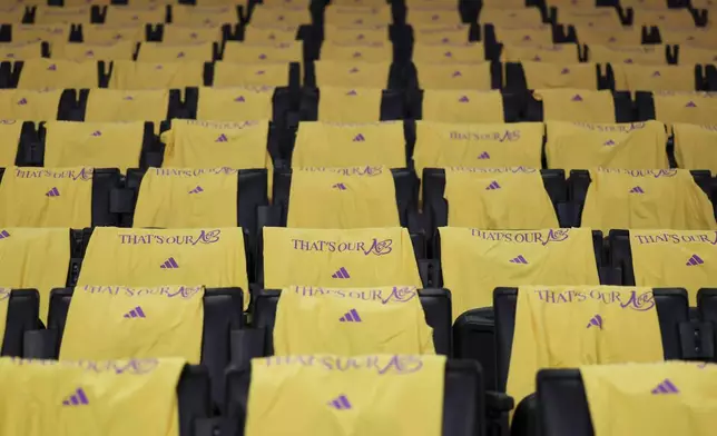 T-shirts are laid out on seats to honor former Los Angeles Sparks player Candace Parker prior to a a WNBA basketball game against Chicago Sky, Sunday, June 29, 2025, in Los Angeles. (AP Photo/Jessie Alcheh)