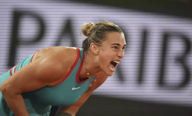 Aryna Sabalenka of Belarus reacts as she plays against Poland's Iga Swiatek during their semifinal match of the French Tennis Open at the Roland-Garros stadium in Paris, Thursday, June 5, 2025. (AP Photo/Thibault Camus)