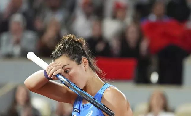 France's Lois Boisson reacts as she plays against Coco Gauff of the U.S. during their semifinal match of the French Tennis Open at the Roland-Garros stadium in Paris, Thursday, June 5, 2025. (AP Photo/Lindsey Wasson)
