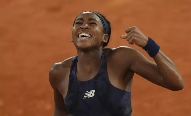 Coco Gauff of the U.S. celebrates as she won the semifinal match of the French Tennis Open against France's Lois Boisson at the Roland-Garros stadium in Paris, Thursday, June 5, 2025. (AP Photo/Aurelien Morissard)
