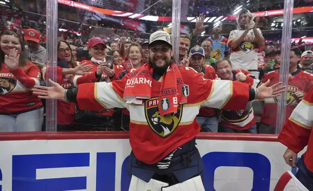 Florida Panthers goaltender Sergei Bobrovsky poses in front of fans after winning the Stanley Cup in Game 6 of the NHL hockey Stanley Cup Final against the Edmonton Oilers Tuesday, June 17, 2025, in Sunrise, Fla. (AP Photo/Lynne Sladky)