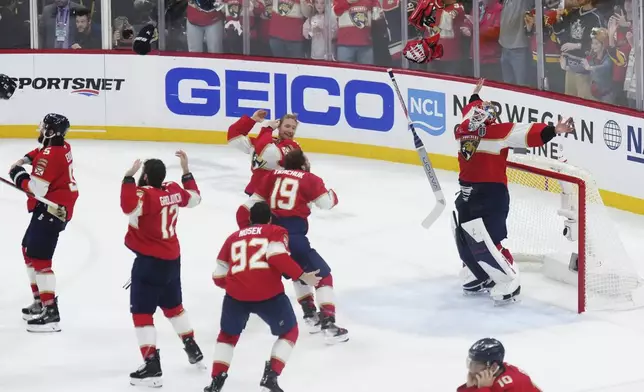 Florida Panthers goalie Sergei Bobrovsky (72) and teammates celebrate after defeating the Edmonton Oilers in Game 6 of the Stanley Cup final in Sunrise, Fla., Tuesday, June 17, 2025. (Nathan Denette/The Canadian Press via AP)