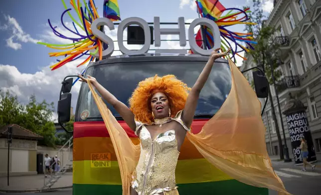 A reveler takes part in the Pride March in Vilnius, Lithuania, Saturday, June 7, 2025. (AP Photo/Mindaugas Kulbis)