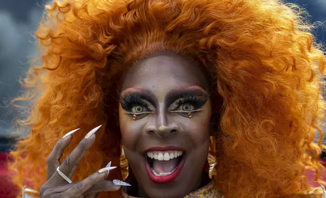 A reveler takes part in the Pride March in Vilnius, Lithuania, Saturday, June 7, 2025. (AP Photo/Mindaugas Kulbis)