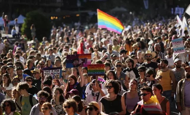 Thousands walk down Liberdade Avenue in Lisbon during the Lisboa Pride march, Saturday, June 7, 2025. (AP Photo/Armando Franca)