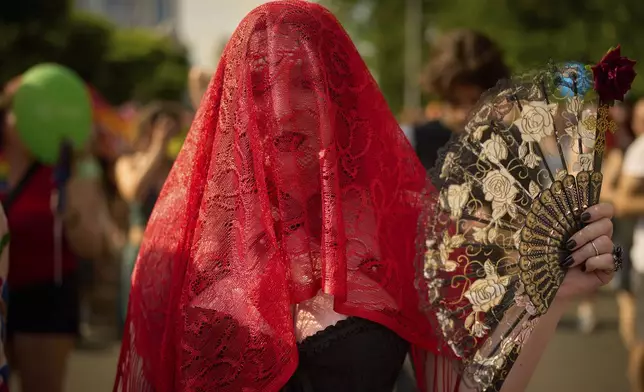 A participant attends the Bucharest Pride Parade in Bucharest, Romania, Saturday, June 7, 2025. (AP Photo/Vadim Ghirda)