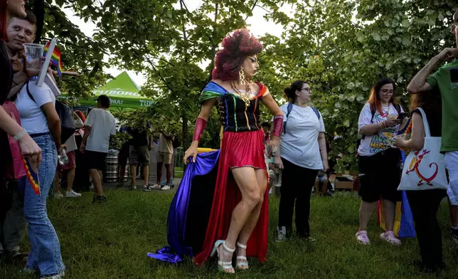 A participant in the Bucharest Pride Parade poses in Bucharest, Romania, Saturday, June 7, 2025. (AP Photo/Andreea Alexandru)