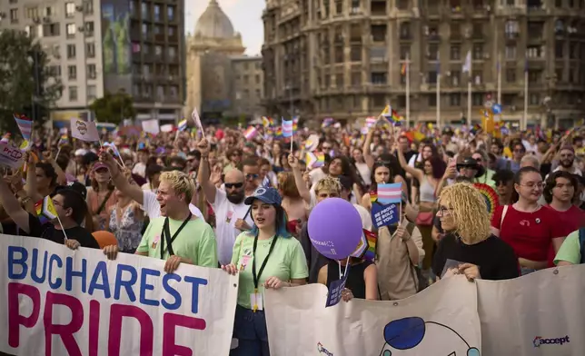 People march during the Bucharest Pride Parade in Bucharest, Romania, Saturday, June 7, 2025. (AP Photo/Vadim Ghirda)