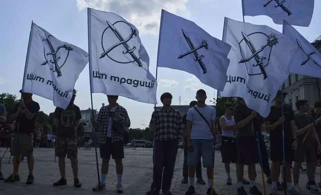 Ultra-right activists protest against the Gay Pride rally in Kyiv, Ukraine, Saturday, June 7, 2025. (AP Photo/Efrem Lukatsky)