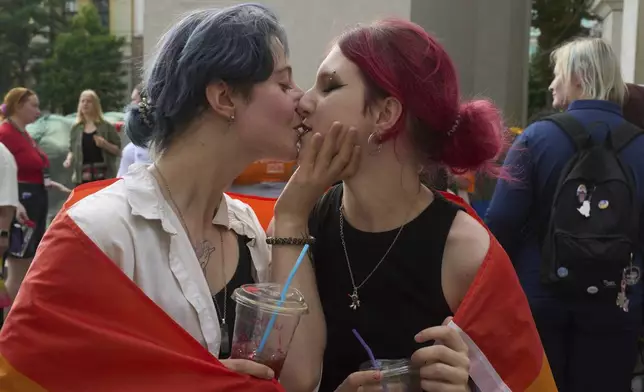 LGBT activists share a kiss during a Gay Pride rally in Kyiv, Ukraine, Saturday, June 7, 2025. (AP Photo/Efrem Lukatsky)