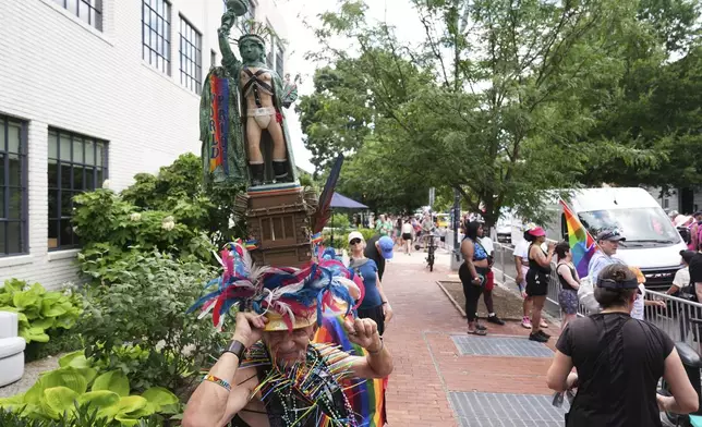 People attend the World Pride parade, Saturday, June 7, 2025, in Washington. (AP Photo/Jacquelyn Martin)