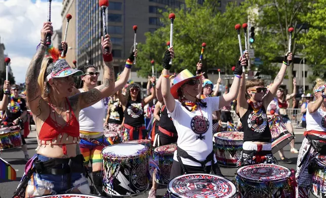 Members of Batalá Washington D.C. perform during the World Pride Parade, Saturday, June 7, 2025, in Washington. (AP Photo/Mark Schiefelbein)