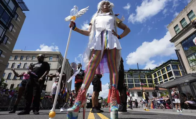 People March during the World Pride parade, Saturday, June 7, 2025, in Washington. (AP Photo/Alex Brandon)