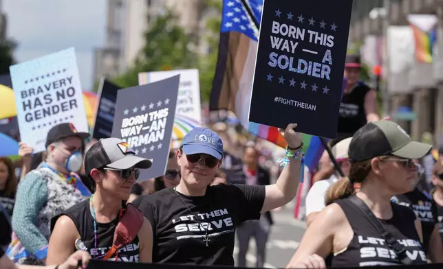 Participants from the Modern Military Association of America attend the World Pride Parade, Saturday, June 7, 2025, in Washington. (AP Photo/Mark Schiefelbein)