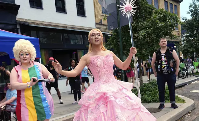 Attendees pose before the World Pride parade, Saturday, June 7, 2025, in Washington. (AP Photo/Julia Demaree Nikhinson)