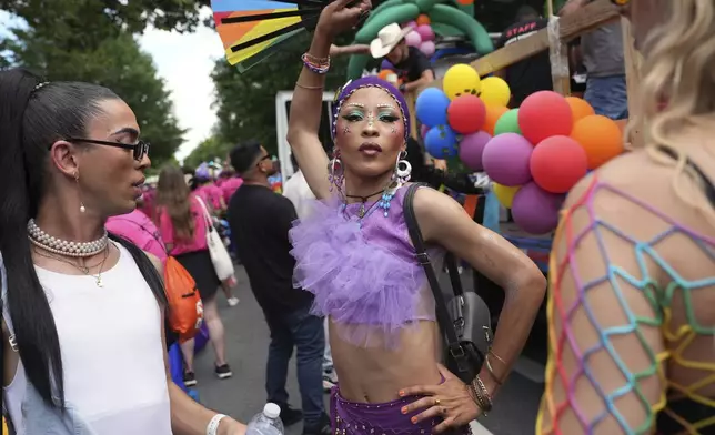 Dame Geisha Mercury, of Namibia, waves a fan at the World Pride parade, Saturday, June 7, 2025, in Washington. (AP Photo/Jacquelyn Martin)