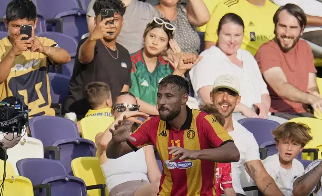 Esperance de Tunis' Youcef Belaili celebrates with fans after scoring his team's first goal during the Club World Cup Group D soccer match between Los Angeles FC and ES Tunisie in Nashville, Tenn., Friday, June 20, 2025. (AP Photo/George Walker IV)