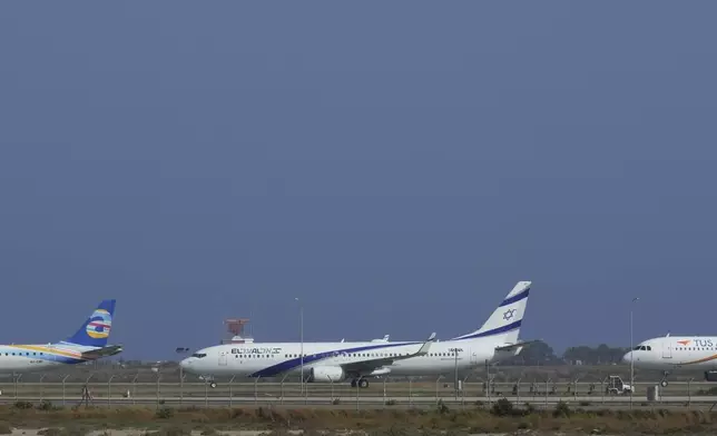 An aircraft belonging to Israeli airlines El Al sit parked in the tarmac of Cyprus' main airport in Larnaca, Saturday, June 14, 2025. (AP Photo/Petros Karadjias)