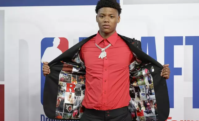 Ace Bailey arrives for the first round of the NBA basketball draft, Wednesday, June 25, 2025, in New York. (AP Photo/Adam Hunger)