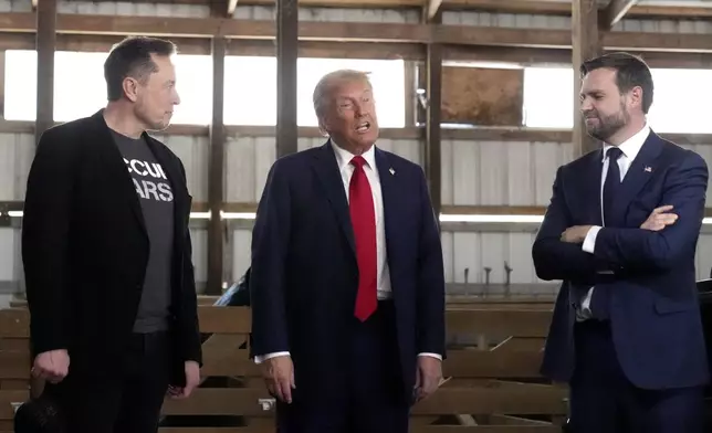 FILE - Tesla and SpaceX CEO Elon Musk, from left, Republican presidential nominee former President Donald Trump and Republican vice presidential nominee Sen. JD Vance, R-Ohio, attend a campaign event, Oct. 5, 2024, in Butler, Pa. (AP Photo/Alex Brandon, File)