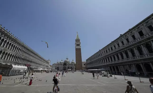 St. Mark's Square, in Venice, Italy, Thursday, June 12, 2025. (AP Photo/Luca Bruno)