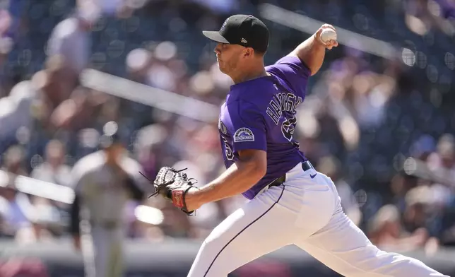 Colorado Rockies relief pitcher Seth Halvorsen works against the Arizona Diamondbacks in the ninth inning of a baseball game, Sunday, June 22, 2025, in Denver. (AP Photo/David Zalubowski)