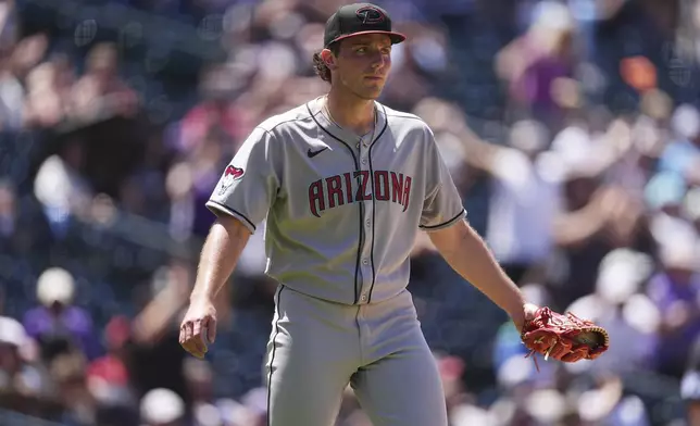 Arizona Diamondbacks starting pitcher Brandon Pfaadt reacts after giving up a three-run home run to Colorado Rockies' Mickey Moniak in the fifth inning of a baseball game Sunday, June 22, 2025, in Denver. (AP Photo/David Zalubowski)