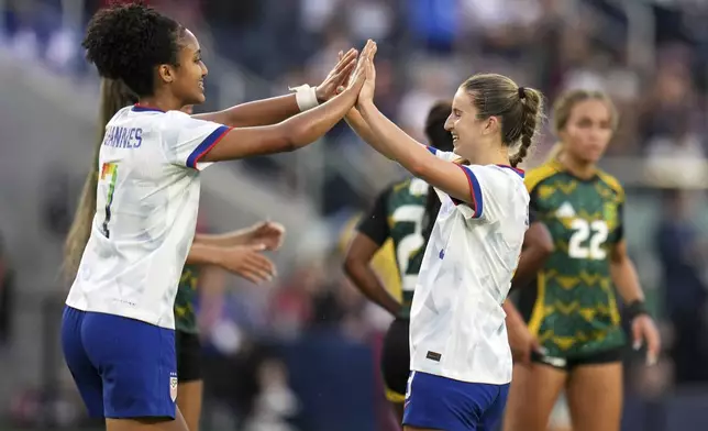United States' Ally Sentnor, right, is congratulated by teammate Lily Yohannes after scoring during the first half of an international friendly soccer match against Jamaica Tuesday, June 3, 2025, in St. Louis. (AP Photo/Jeff Roberson)