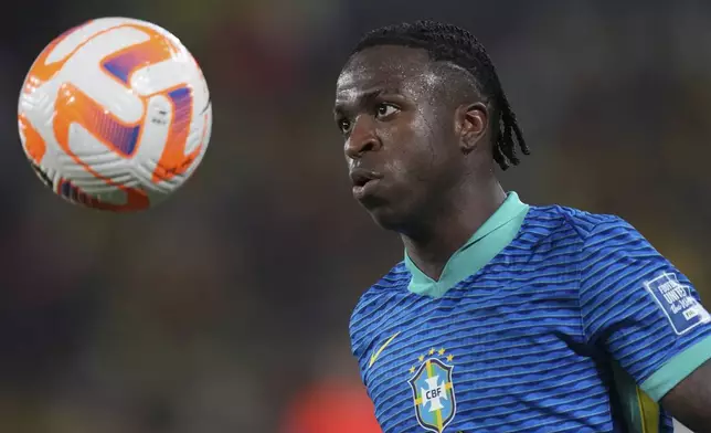 Brazil's Vinicius Junior eyes the ball during a World Cup 2026 qualifying soccer match against Ecuador at Banco Pichincha stadium in Guayaquil, Ecuador, Thursday, June 5, 2025. (AP Photo/Dolores Ochoa)