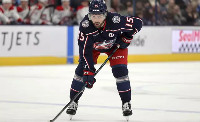 FILE - Columbus Blue Jackets defenseman Dante Fabbro waits on the puck drop against the Montreal Canadiens during an NHL hockey game in Columbus, Ohio, Dec. 23, 2024. (AP Photo/Paul Vernon, file)