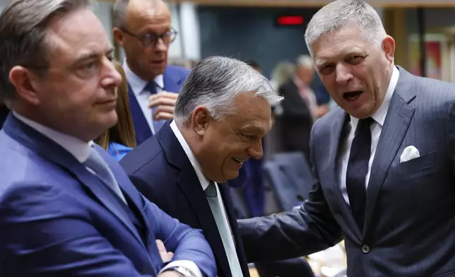 From left, Belgium's Prime Minister Bart De Wever, Germany's Chancellor Friedrich Merz, Hungary's Prime Minister Viktor Orban and Slovakia's Prime Minister Robert Fico attend a round table meeting at an EU summit in Brussels, Thursday, June 26, 2025. (AP Photo/Geert Vanden Wijngaert)