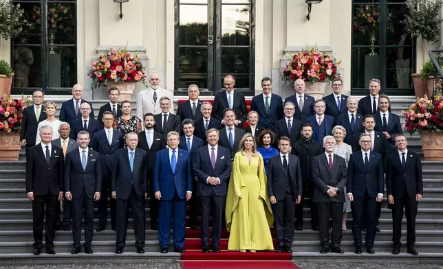 Participants pose for a family photo at the 2025 NATO summit in The Hague, on Tuesday, June 24, 2025. (Haiyun Jiang/Pool Photo via AP)