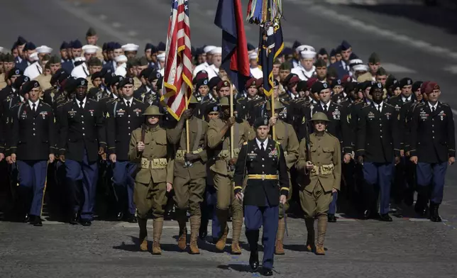 FILE - U.S troops march down the Champs Elysees during the Bastille Day parade in Paris, July 14, 2017. (AP/Photo/Markus Schreiber, File)