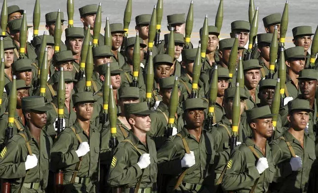 FILE - Cuban soldiers march during a military parade along the Revolution Square in Havana, Cuba, Dec. 2, 2006. (AP Photo/ Javier Galeano, File)