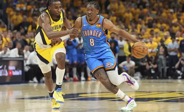 Oklahoma City Thunder forward Jalen Williams (8) drives as Indiana Pacers forward Aaron Nesmith defends during the second half of Game 4 of the NBA Finals basketball series, Friday, June 13, 2025, in Indianapolis. (AP Photo/Michael Conroy)