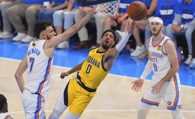 Indiana Pacers guard Tyrese Haliburton (0) shoots as Oklahoma City Thunder forward Chet Holmgren (7) defends during the second half of Game 5 of the NBA Finals basketball series, Monday, June 16, 2025, in Oklahoma City. (AP Photo/Kyle Phillips)