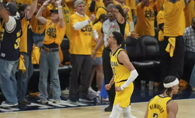 Indiana Pacers guard Tyrese Haliburton (0) celebrates a basket against the Oklahoma City Thunder during the first half of Game 6 of the NBA Finals basketball series, Thursday, June 19, 2025, in Indianapolis. (AP Photo/Michael Conroy)