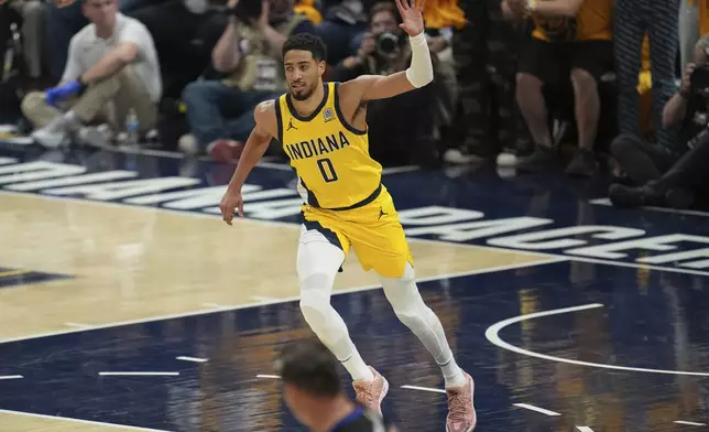 Indiana Pacers guard Tyrese Haliburton celebrates a basket against the Oklahoma City Thunder during the first half of Game 6 of the NBA Finals basketball series, Thursday, June 19, 2025, in Indianapolis. (AP Photo/Michael Conroy)
